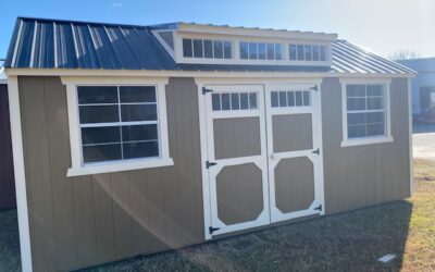 side utility 10×20, 7′ walls w/ dormer package,                 two 3×3 windows, double doors w/ windows,        buckskin w/ burnished slate roof and painted trim